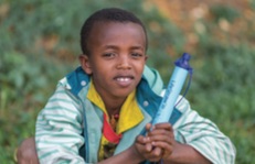 Child with Lifestraw